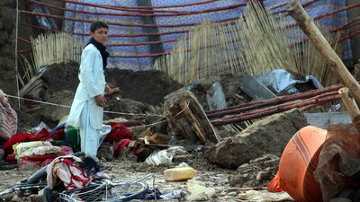 People salvage their belongings after flash floods in Kandahar, Afghanistan on March 2, 2019. EPA