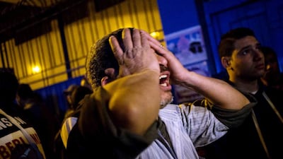 Outside a Cairo morgue where the bodies were taken, dozens of relatives wept and wailed while others pored over a list of the dead, trying to identify loved ones. Hamada El Rasam / AFP Photo