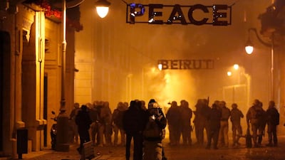 Special forces police advance as they push back the anti-government protesters in downtown Beirut. AP Photo