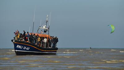 A rescue boat arrives on the English coast after picking up migrants crossing the Channel. AFP