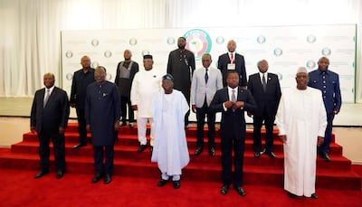 Nigeria's President, Bola Ahmed Tinubu, center first row, poses for a group photo with other West African leaders before an Ecowas meeting in Abuja, Nigeria. AP