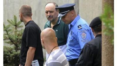 Goran Hadzic, in green shirt, arrives in July this year at the house in Serbia, where he lived before he went hiding in 2004. Authorities tracked him down in the northern mountains, and arrested the last remaining fugitive sought by the UN war crimes court after he spent eight years on the run. AP Photo
