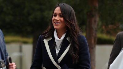 Meghan Markle, in a J Crew coat, arrives in Birmingham, England, on March 8, 2018. Getty Images