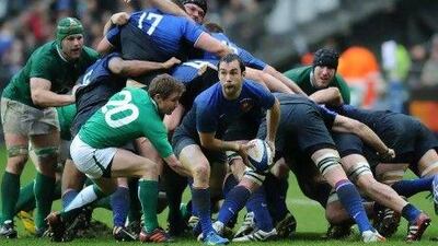 France's scrum-half Morgan Parra, centre, passes the ball in the Six Nations tournament match against Ireland