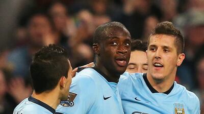 Yaya Toure, centre, of Manchester City celebrates his goal with teammates during the Premier League match against Swansea City at Etihad Stadium on November 22, 2014, in Manchester, England. Alex Livesey / Getty Images