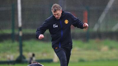 David Moyes avoiding Wayne Rooney's challenge during Tuesday's training session. Laurence Griffiths / Getty Images/ March 18, 2014