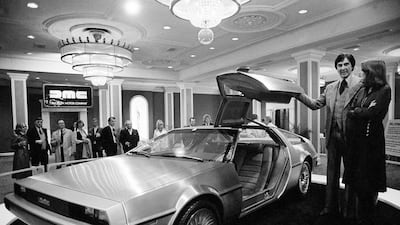 John DeLorean and his wife Christina with his namesake prototype car. Jack Thornell / AP