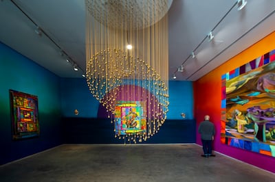 The centerpiece of the presentation is a chandelier-like installation made up of more than 1,000 brass bells. Ahmed Ramzan for The National