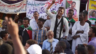 A young man speaks to a crowd of protesters. Getty Images