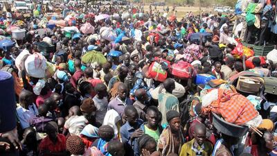 Civilians gather outside a UN compound in Bor, believed captured by forces loyal to fugitive former vice president Riek Machar. Rolla Hinedi / AFP