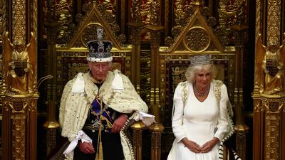 King Charles III sits alongside Queen Camilla before reading the King's Speech from the sovereign's throne in the House of Lords chamber, during the State Opening of Parliament on July 17. Getty Images