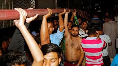 Bangladeshi firefighters and locals try to extinguish fire at Chawk bazar's Churihatta area, Old Dhaka. EPA