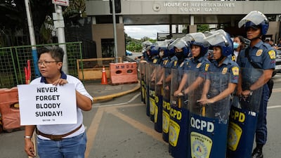 A protester in Manila, Philippines, at a demonstration about an alleged extrajudicial killings case dubbed "Bloody Sunday". EPA