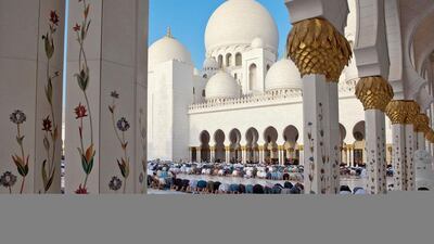 Worshippers gather at the Grand Mosque in Abu Dhabi during Eid morning prayers. Antonie Robertson / The National