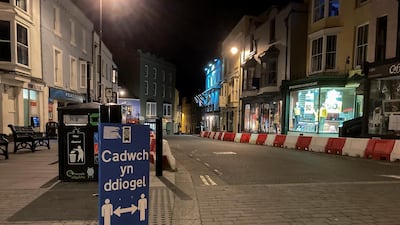 A social distancing sign in Wales, where paramedics say they are seeing more calls with a mental health aspect. Reuters
