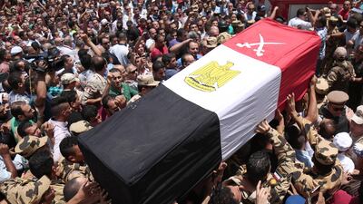 Egyptians carry the coffin of a soldier who was killed a day earlier in the restive Sinai Peninsula in an attack by ISIL, during a funeral ceremony in the 10th of Ramadan city, about 60km north of Cairo, on July 8, 2017. Mahmoud Bakkar / AFP