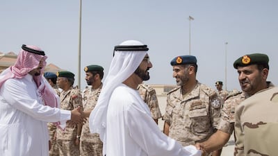 Sheikh Mohammed and Prince Salman bin Sultan, Saudi Arabia's Deputy Minister of Defence, greet military personnel who took part in a joint UAE-Egypt military exercise in Al Gharbia in March 2014. Photo: Crown Prince Court - Abu Dhabi