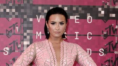 Singer Demi Lovato arrives on the red carpet for the 32nd MTV Video Music Awards at the Microsoft Theater in Los Angeles. Paul Buck / EPA