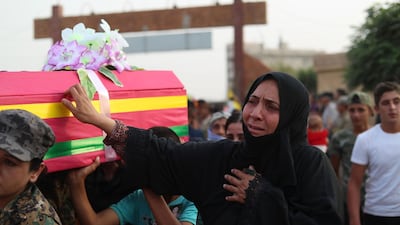 A woman mourns at a funeral for the Syrian Democratic Forces fighters killed in clashes with ISIS, Qamishli, September 14, 2018. AFP
