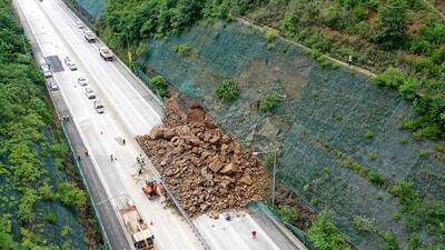 A landslide caused by heavy rain blocks an expressway in Gunwi, North Gyeongsang Province, South Korea. EPA
