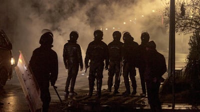 Security forces gather during clashes with demonstrators, at the scene of a protest against living conditions and unemployment in the Tunisian city of Siliana, the capital of the governorate of the same name, about 130 kms southwest of the capital Tunis . Tunisian security forces arrested dozens of young people after disturbances during two consecutive nights in the capital and other cities, the interior minister said. The troubles come amid a nationwide lockdown imposed since January 14, as part of efforts to curb the spread of infections by the coronavirus. AFP