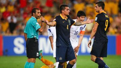Tim Cahill, centre, has warned China to expect the rough treatment when they play Australia in the Asian Cup quarter-finals. Patrick Hamilton/AFP