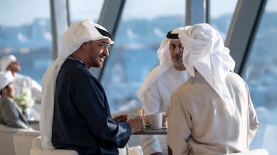Sheikh Mohamed at the Grand Prix with Sheikh Omar bin Zayed, deputy chairman of the board of trustees of the Zayed bin Sultan Al Nahyan Charitable and Humanitarian Foundation. Hamad Al Kaabi / Presidential Court
