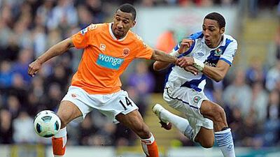 Elliot Grandin of Blackpool holds off Steven N'Zonzi of Blackburn at Ewood Park. Michael Regan / Getty Images
