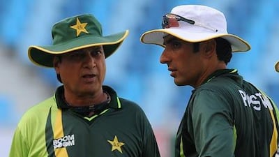 Misbah-ul-Haq, the Pakistan captain, right, talks to Mohsin Khan, the coach, at a practice session in Dubai yesterday.