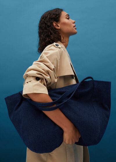 An oversized denim shopper from Mango's Upcycled Accessories collection