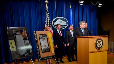 US Attorney General, William Barr speaks next to displayed pictures of the shooter's phone at a press conference regarding the December 2019 shooting at the Pensacola Naval air station in Florida. AFP