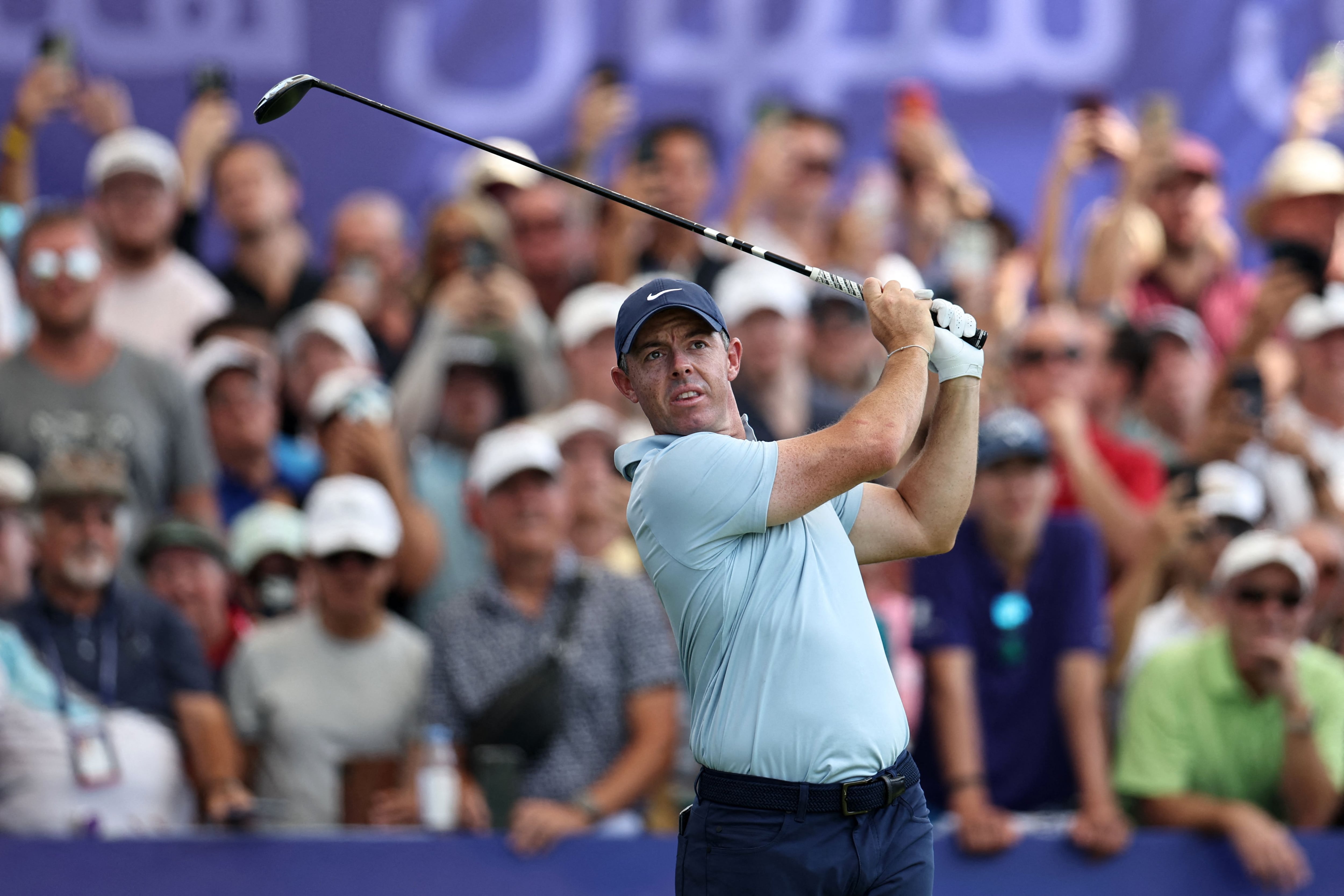 Rory McIlroy plays a shot on his way to a final round 67 to tie for the lead at 18-under. AFP
