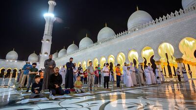 Isha prayer at Sheikh Zayed Grand Mosque in Abu Dhabi, where many say they feel privileged to pray in one of the world's most recognisable places of worship. All photos: Victor Besa / The National