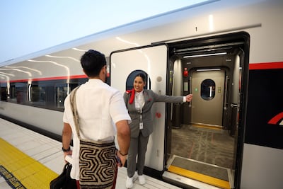 Passengers board the Dubai train service to Abu Dhabi. Chris Whiteoak / The National