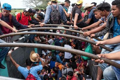 Migrants heading in a caravan to the US hitch a ride on a lorry in Mexico's Veracruz state on November 3, 2018. AFP