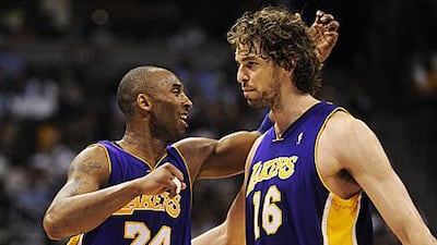 The Magic's Dwight Howard will guard Pau Gasol, right, closely potentially leaving the way clear for Kobe Bryant, left.