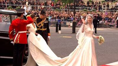 Kate Middleton waves as she arrives at Westminster Abbey for her wedding in London.
