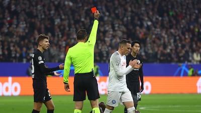 Eintracht Frankfurt's Randal Kolo Muani is shown a red card by referee Artur Soares Dias. Reuters