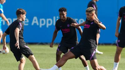 Barcelona's players (L-R) Gavi, Fati and Araujo are seen during the team's training session at Joan Gamper sports city in Barcelona, Spain, 28 September 2021. Barcelona will play Benfica in a UEFA Champions League match on 29 September 2021. EPA / Alejandro Garcia