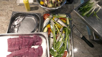 Yellowfin tuna, mackerel and asparagus are ready to be grilled at the #healthyliving cooking experience. Silvia Razgova / The National