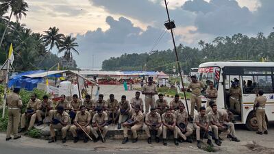Police officers are deployed as fishermen protest near the entrance of the proposed Vizhinjam Port in the southern state of Kerala, India. Reuters