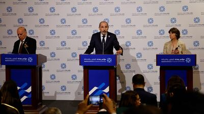 Jordanian Foreign Affairs Minister Ayman Safadi, centre, and his Iraqi and French counterparts, Fouad Hussein and Catherine Colonna, field questions during a press conference at the conference. AFP