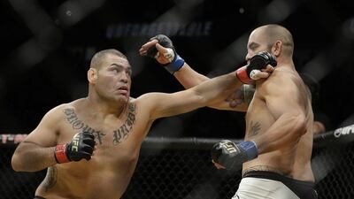 Cain Velasquez, left, fights Travis Browne during their heavyweight bout at UFC 200, Saturday, July 9, 2016, in Las Vegas. John Locher / AP Photo
