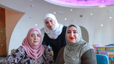 Abu Dhabi Ladies Forum, a group of expats and local ladies who engage in social activities, was created by Hanan Wehbe (centre). Members include Lisa Kanso (left) and Naglaa Fathy (right). Victor Besa / The National
