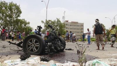 Members of the pro-government Southern Resistance gather at the site of a car bomb attack in the southern port city of Aden on July 31, 2016. Reuters