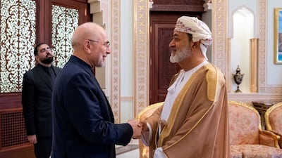 Sultan Haitham shakes hands with Mr Ghalibaf