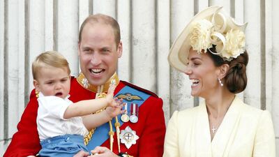 Prince William holds Prince Louis as Catherine, Duchess of Cambridge, laughs while on the balcony of Buckingham Palace to watch the Trooping the Colour, the Queen's annual birthday parade, in June 2019. Getty Images