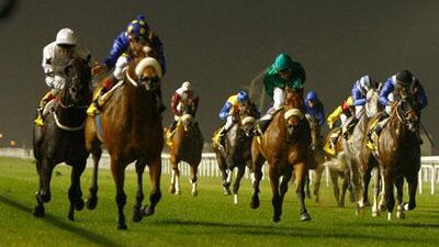 JJ The Jet Plane, second left in purple silks, ridden by Bernard Fayd’Herbe, charges past the field to win the third race last night.