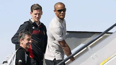Jan Vertonghen, left, and Vincent Kompany board Belgium's team plane bound for Brazil on Tuesday. Francois Lenoir / Reuters / June 10, 2014