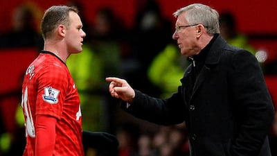 Wayne Rooney shown with Alex Ferguson during a Premier League match in January 2013 during their final season together at Manchester United. Andrew Yates / AFP / January 30, 2013